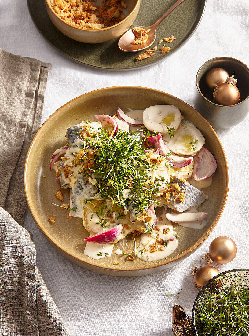 Herring fillets with potato salad and cress