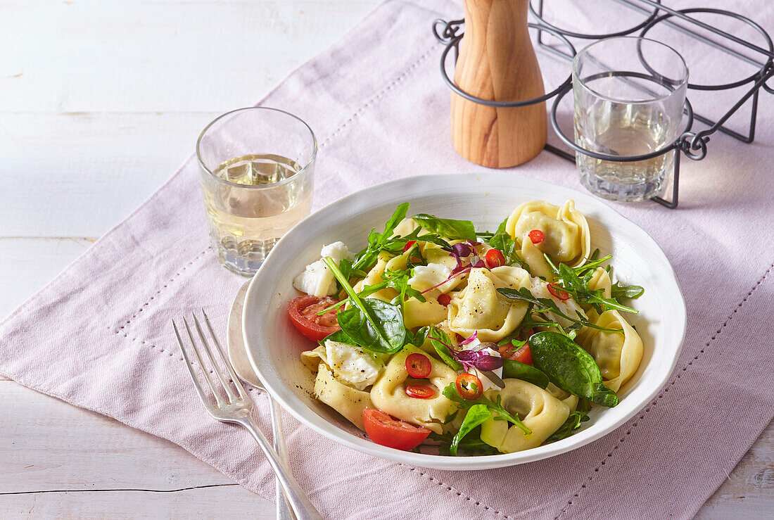 Tortellini salad with mozzarella, rocket and tomatoes