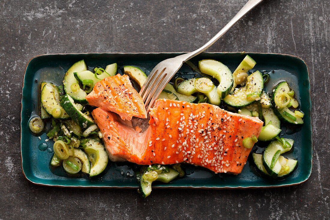 Grilled teriyaki salmon on cucumber salad