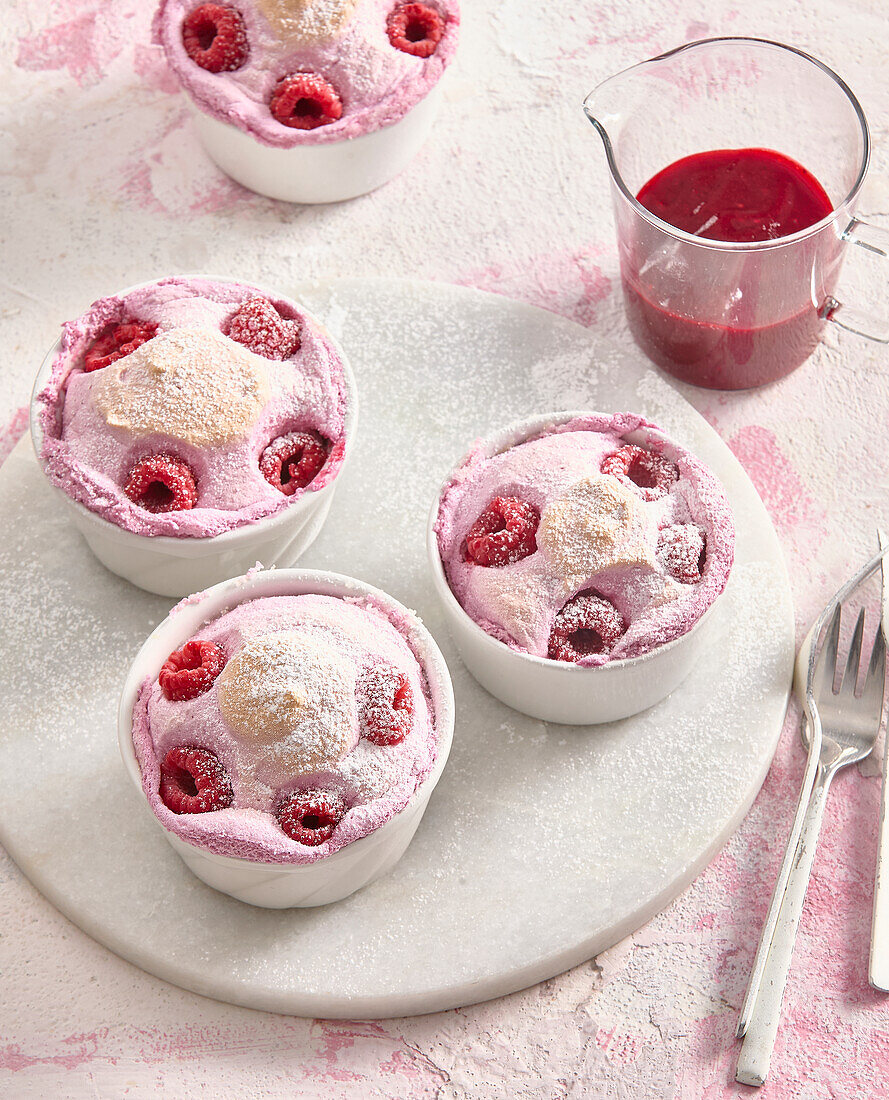 Raspberry soufflé with raspberry sauce