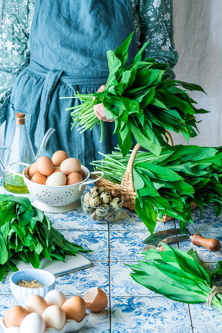 Woman holding a bunch of fresh wild garlic