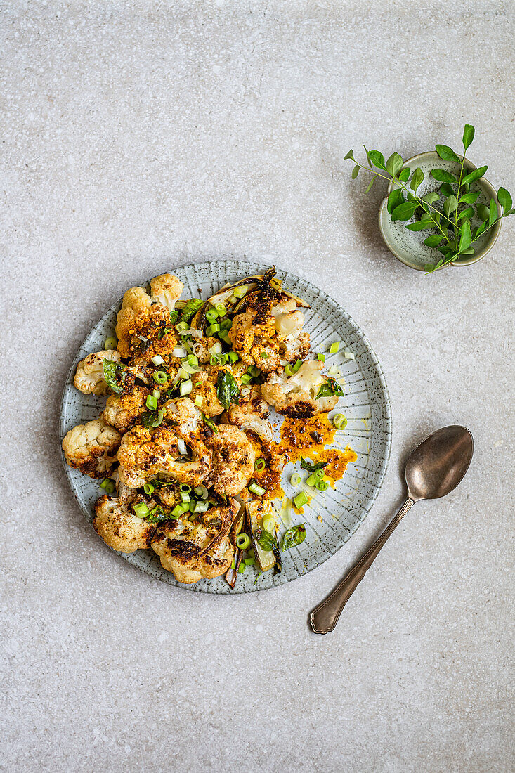 Roasted cauliflower with spring onions, curry leaves and gunpowder spice mix