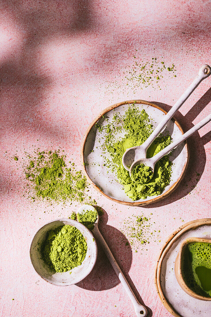 Matcha powder in bowls and spoons