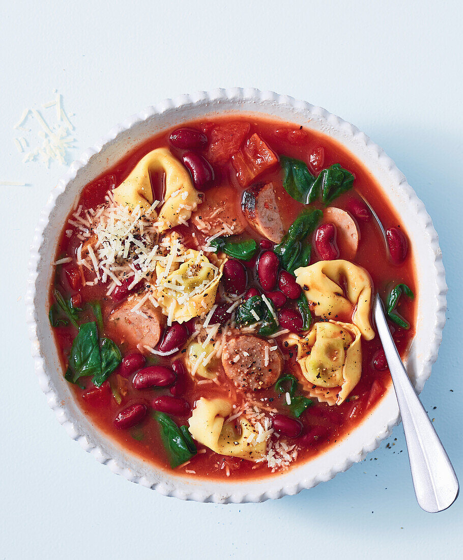 Tuscan tortellini soup with parmesan and beans