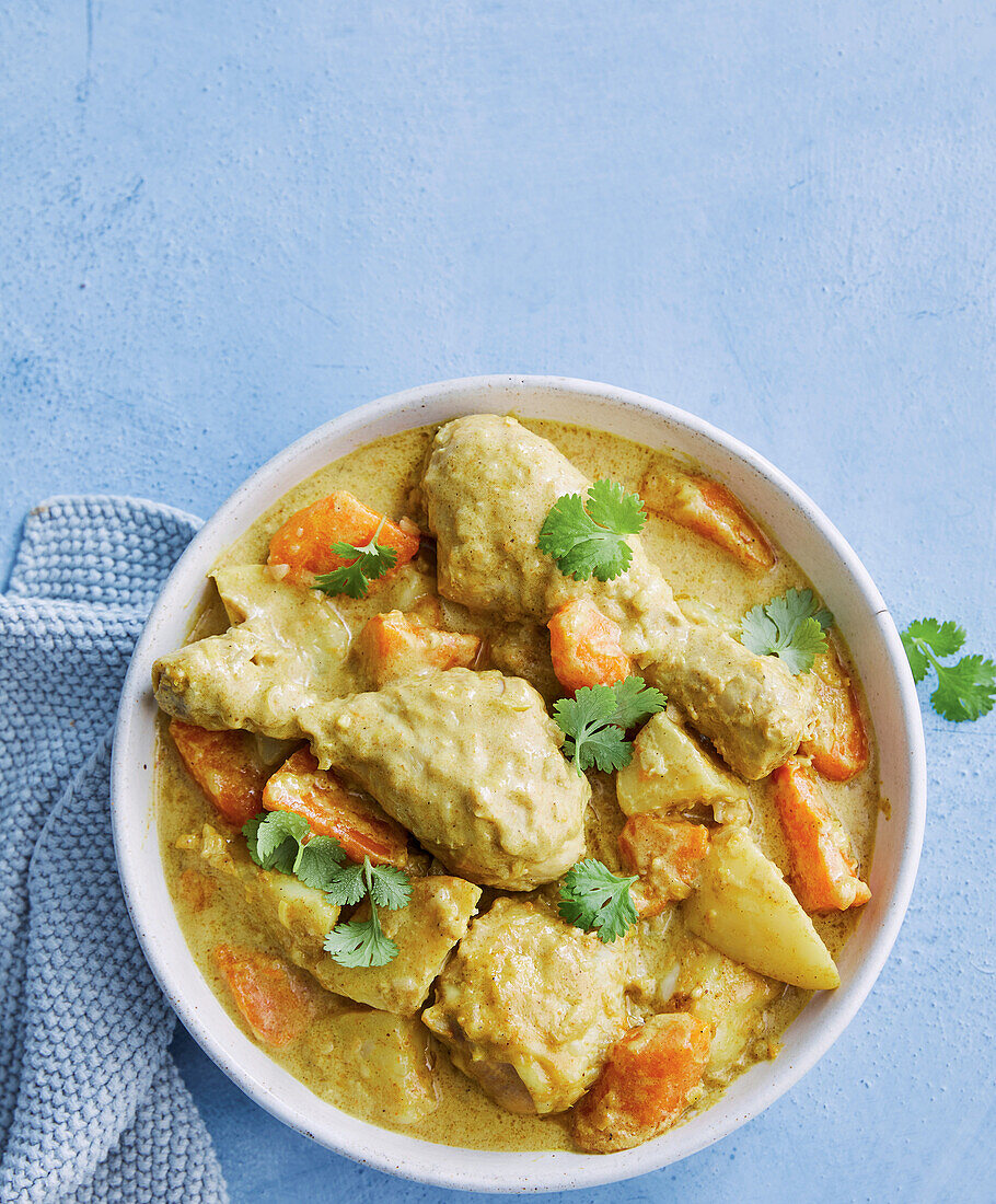 Creamy chicken curry with potatoes and carrots