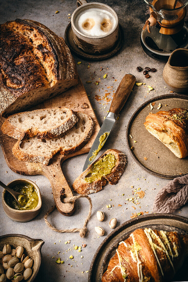 Pistachio cream with croissants and country bread