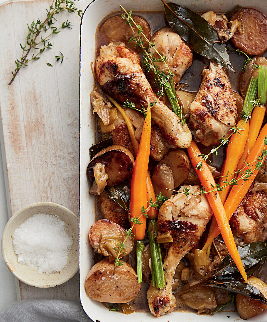 Braised chicken drumsticks with carrots and potatoes from the slow cooker