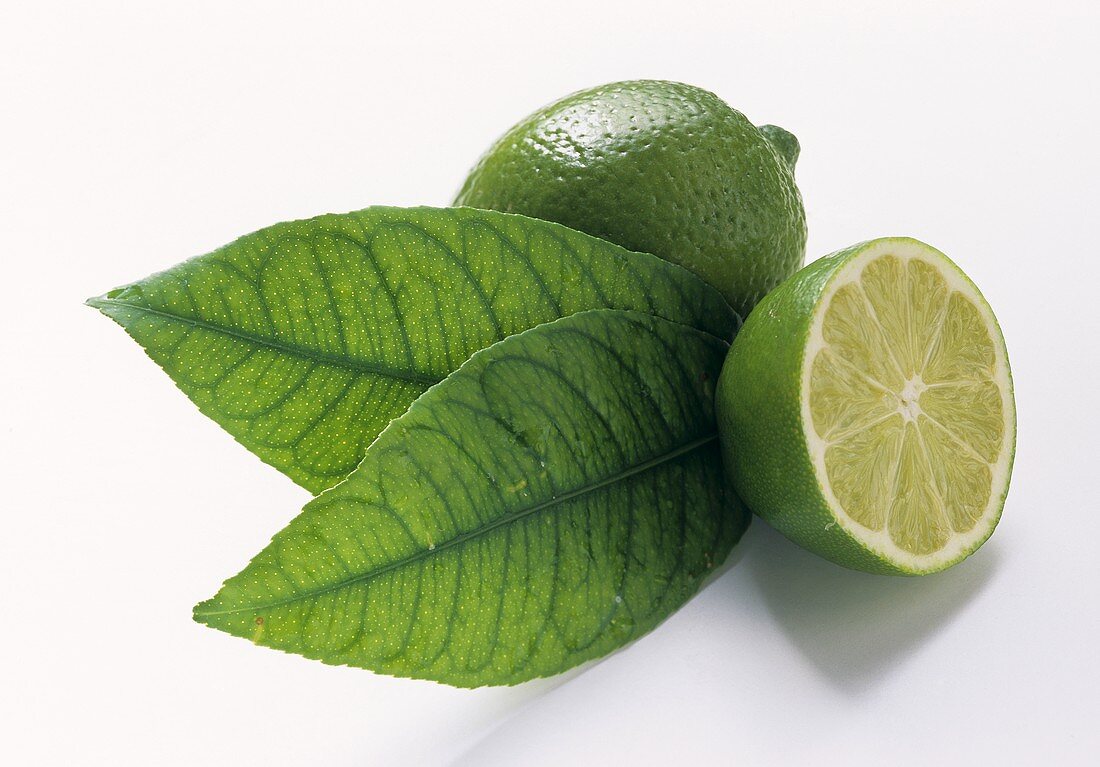 Whole and half lime, two leaves