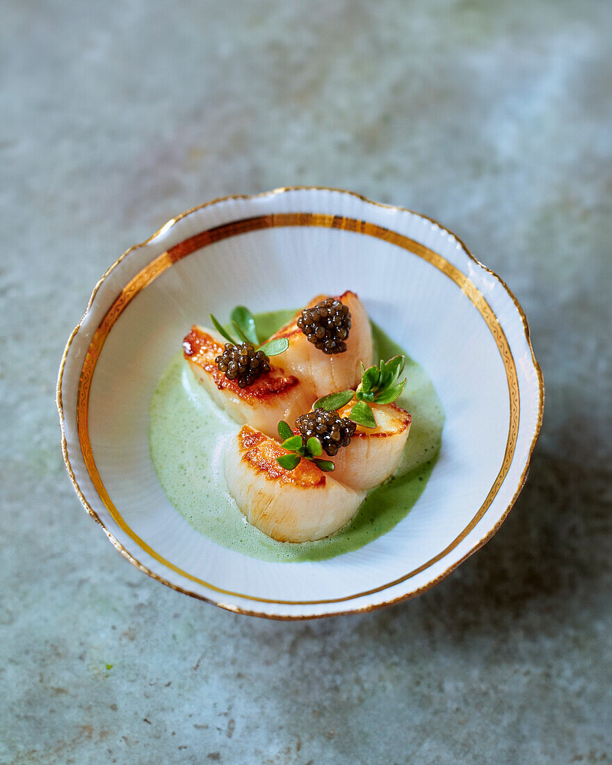 Scallops with caviar and purslane velouté