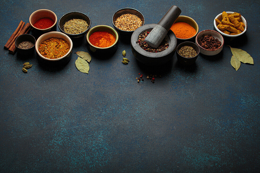 Various spices and herbs in bowls