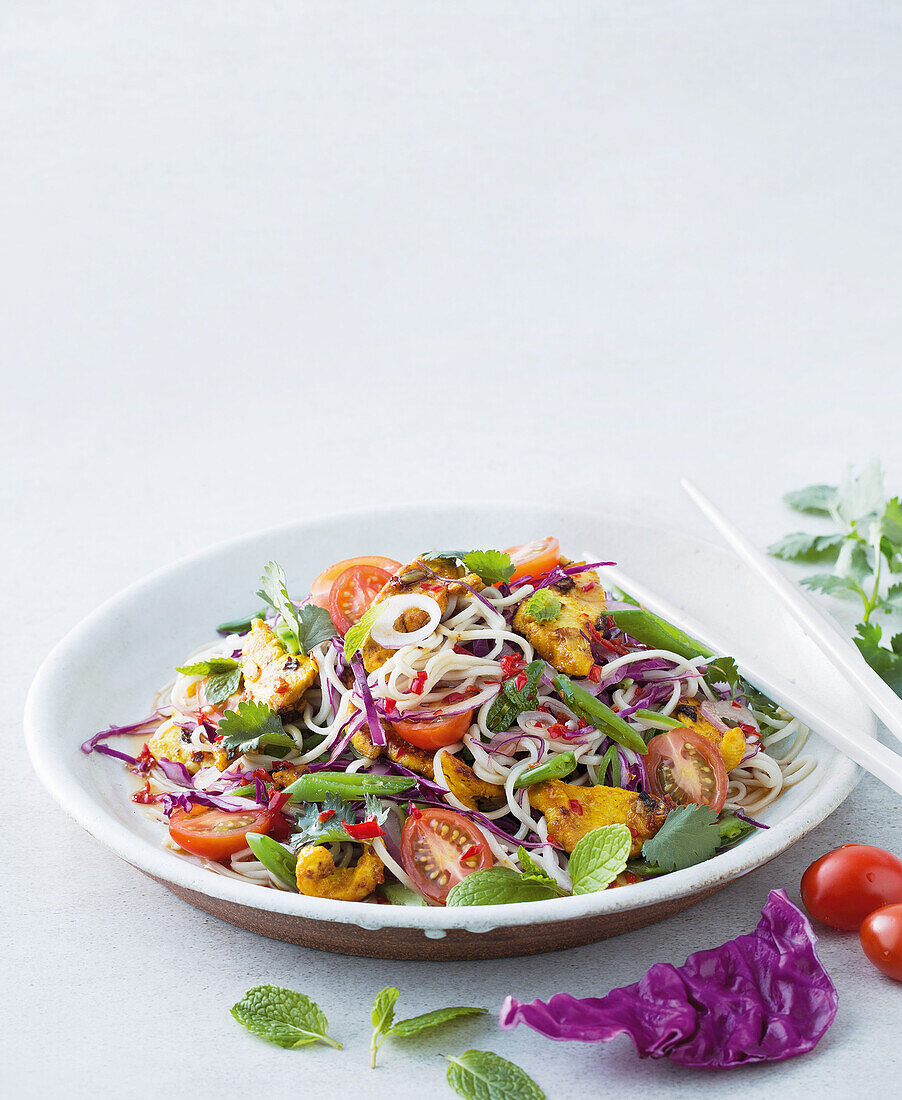 Pasta salad with lemon chicken, vegetables and herbs