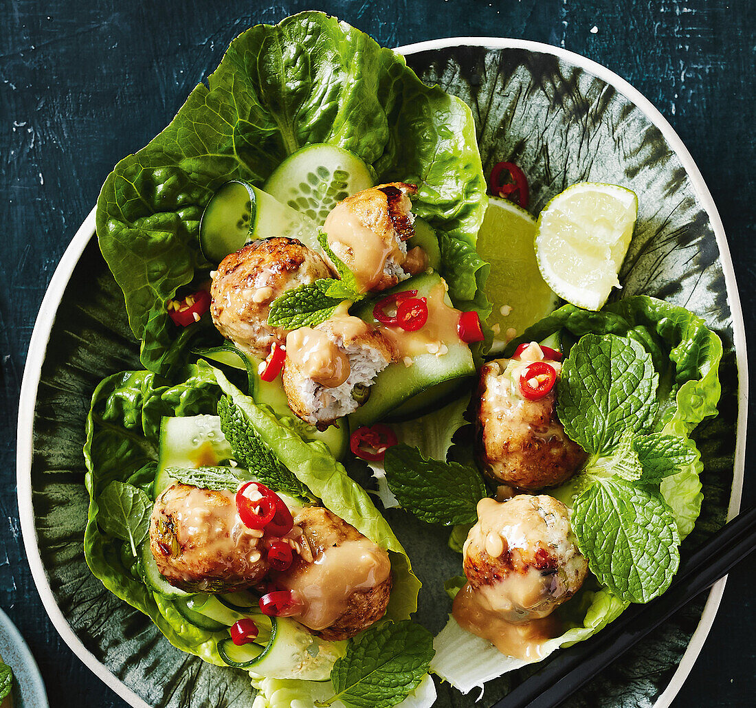 Chicken meatballs with chia on lettuce leaves