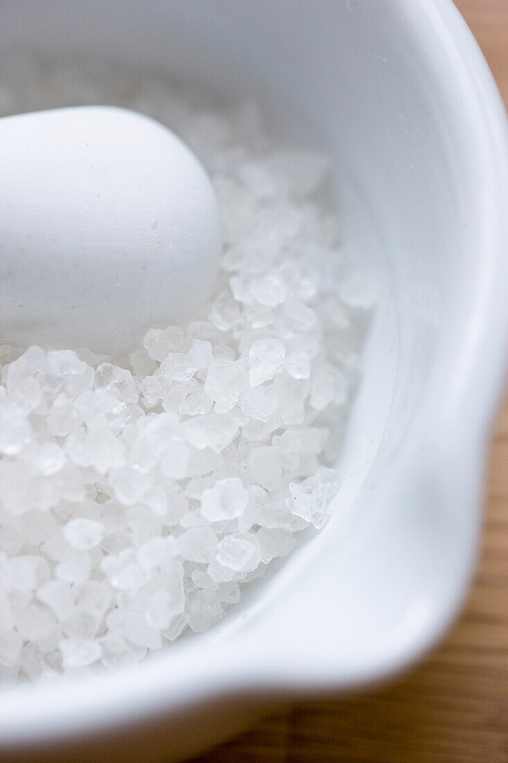 Mortar and Pestle Filled with Rock Salt