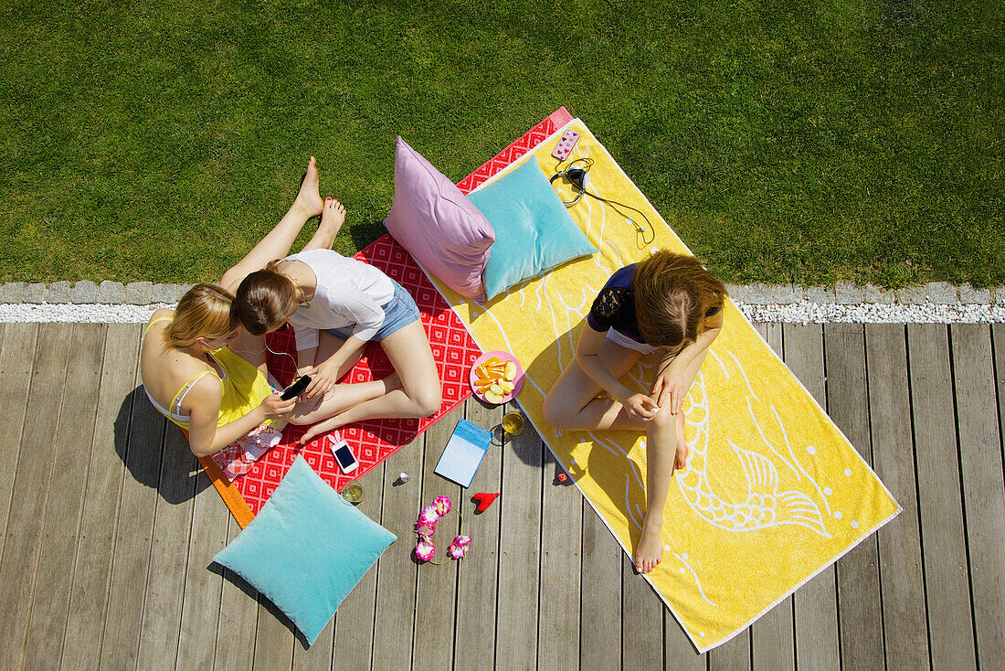 Teenage Girls Hanging Out in Garden, Elevated View