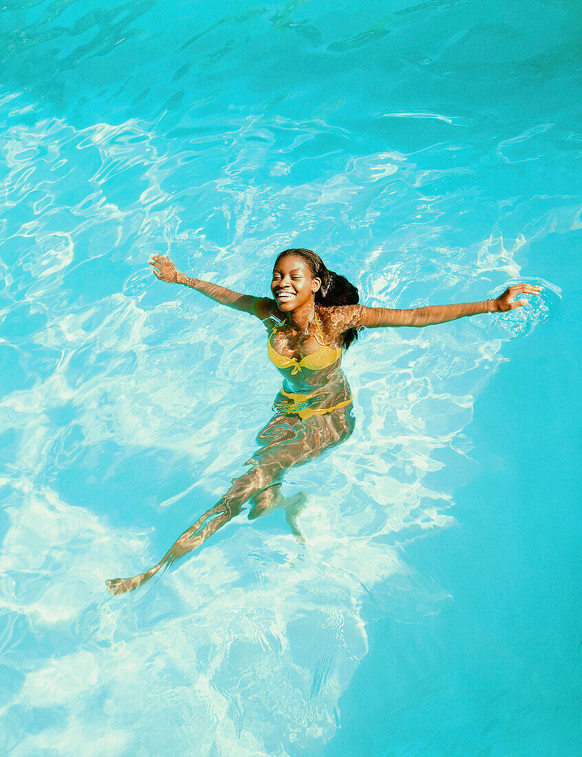 Young Woman in Swimming Pool Smiling