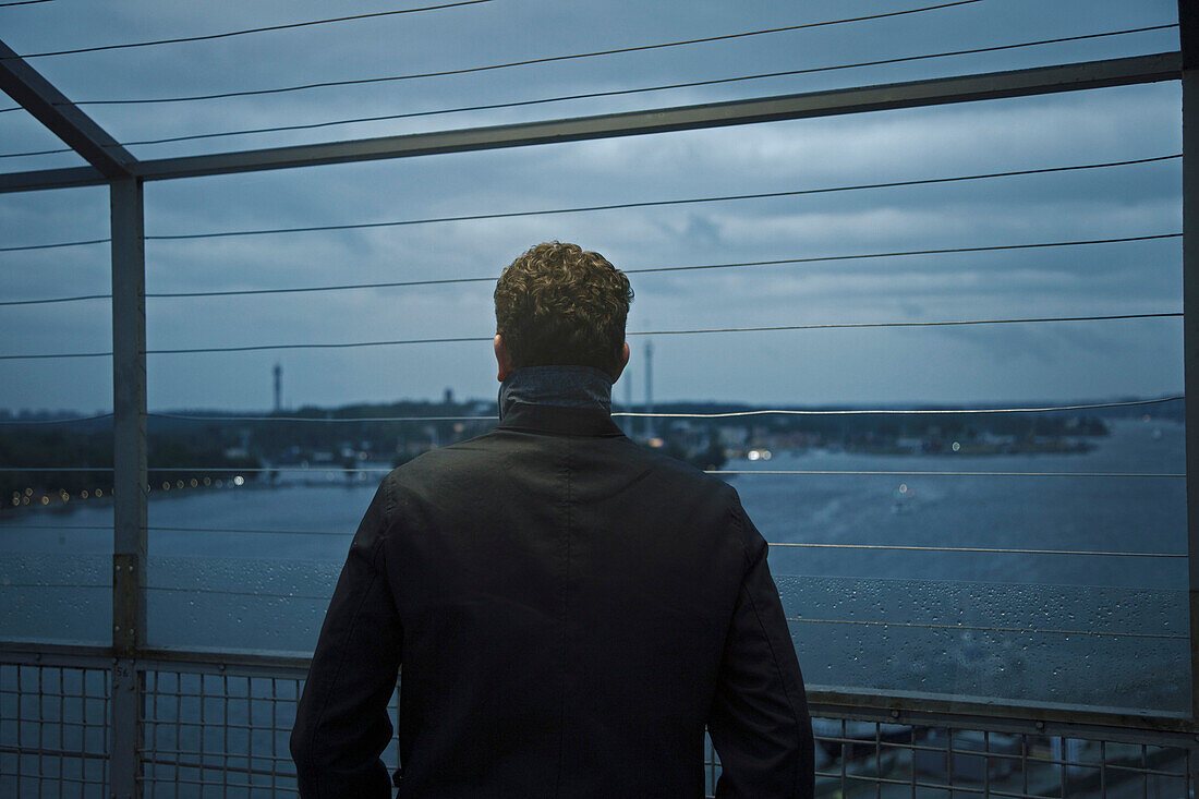 Back View of Man Looking Out from Observation Deck, Stockholm, Sweden