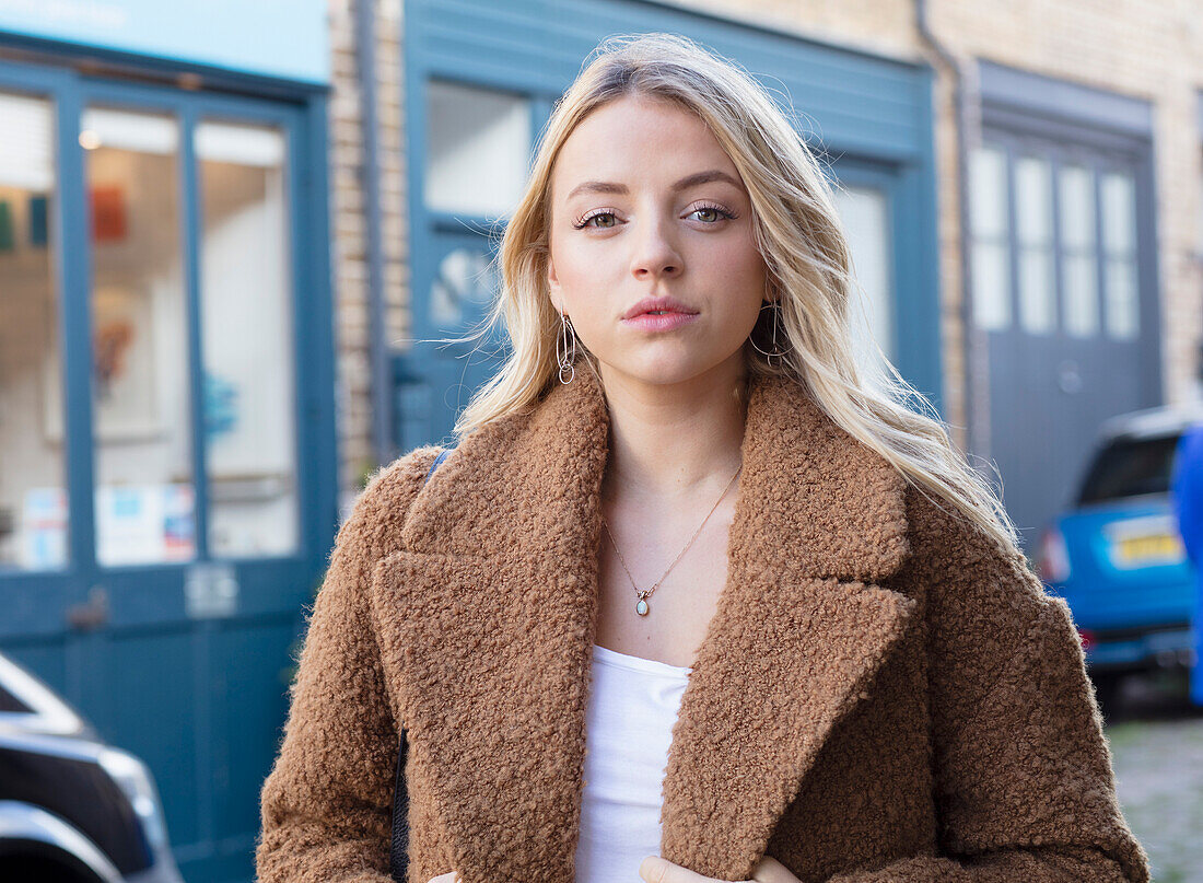 Portrait of Young Woman in City Street