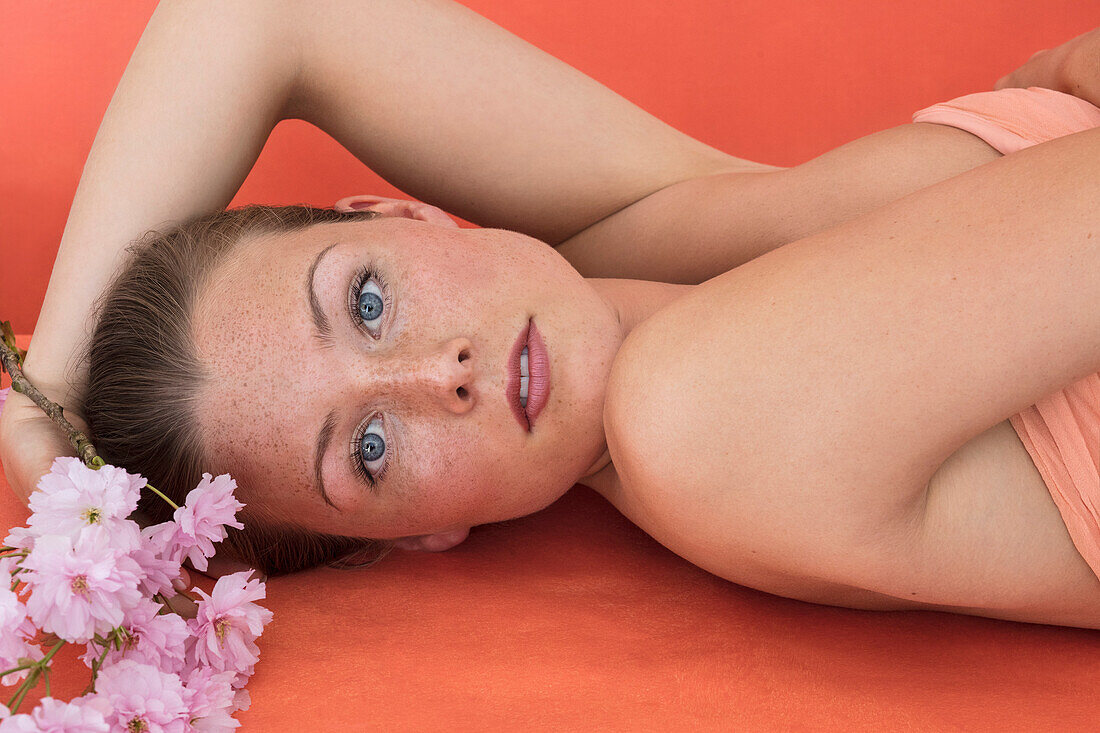 Beauty Portrait of Woman with Cherry Blossom