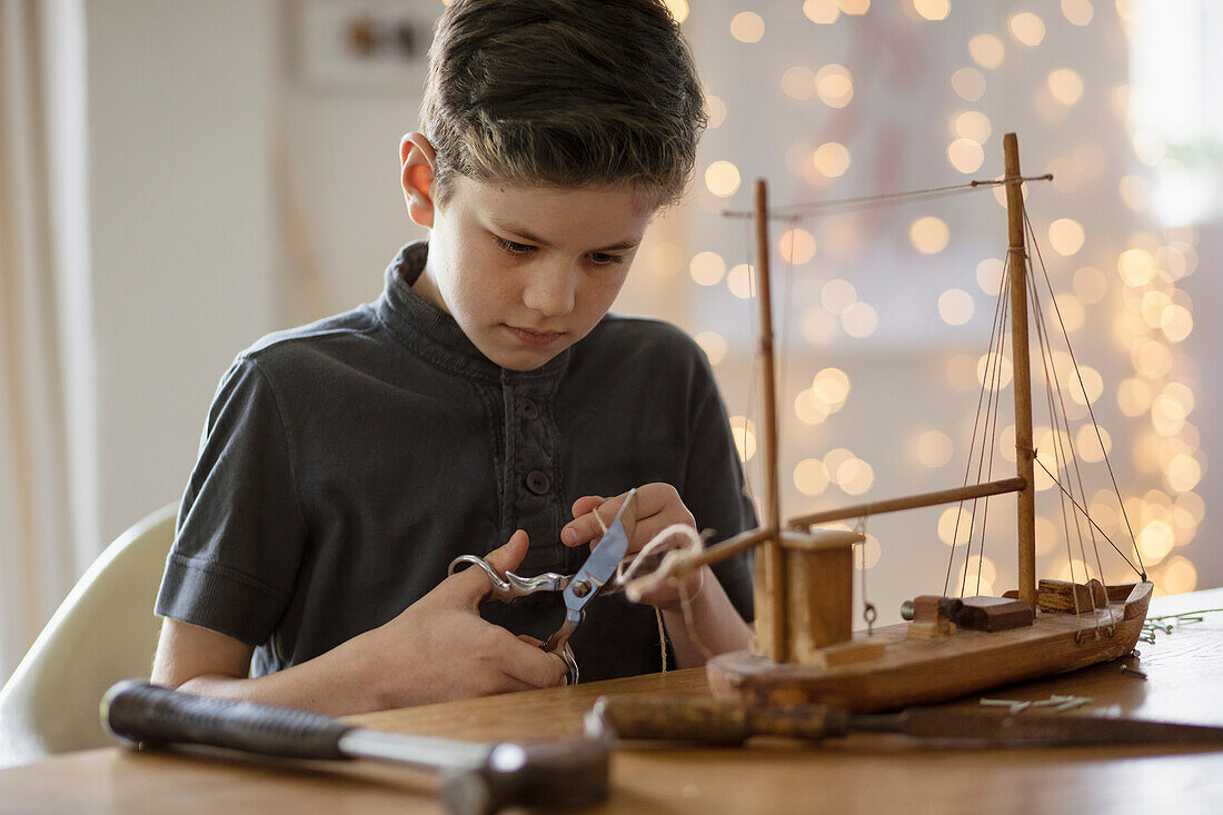 Boy Working on Model Ship