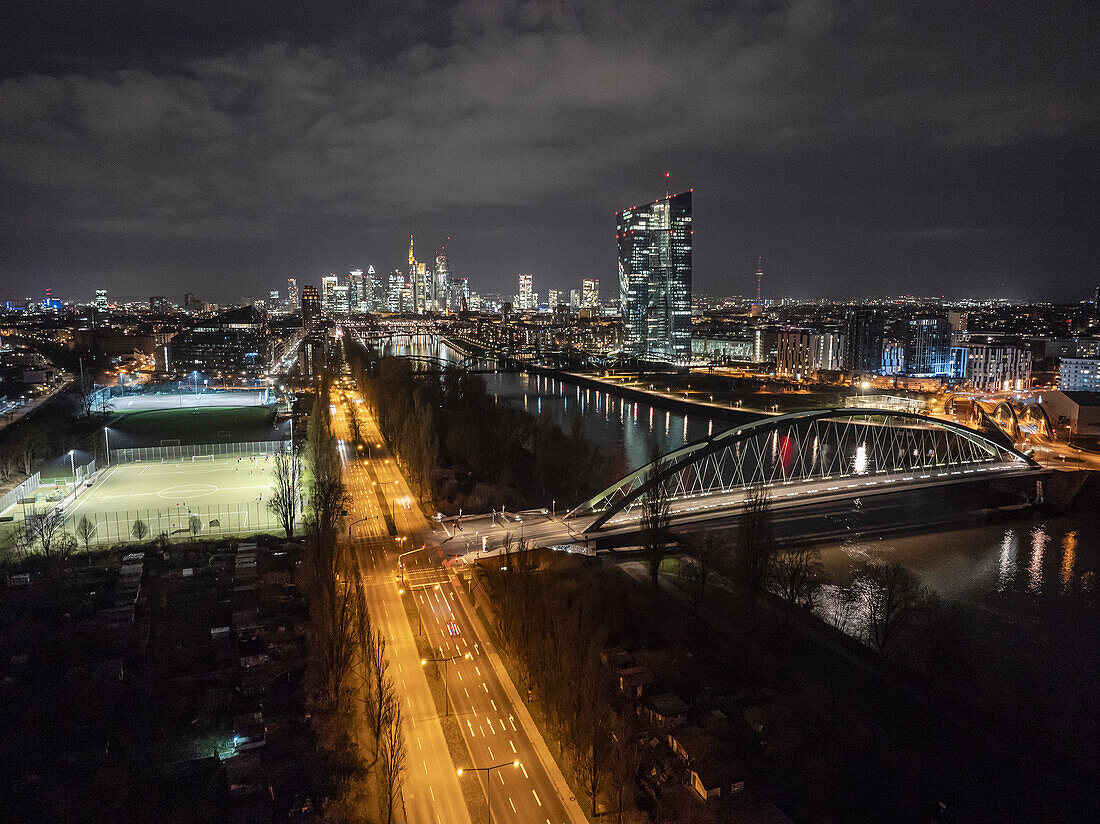 Aerial view European Central Bank skyscraper, bridge and cityscape at night, Frankfurt, Germany