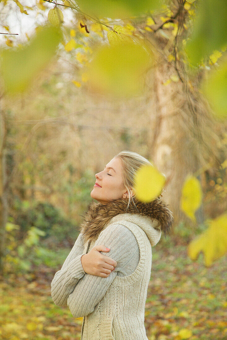 Profile of Young Woman in Autumn Park