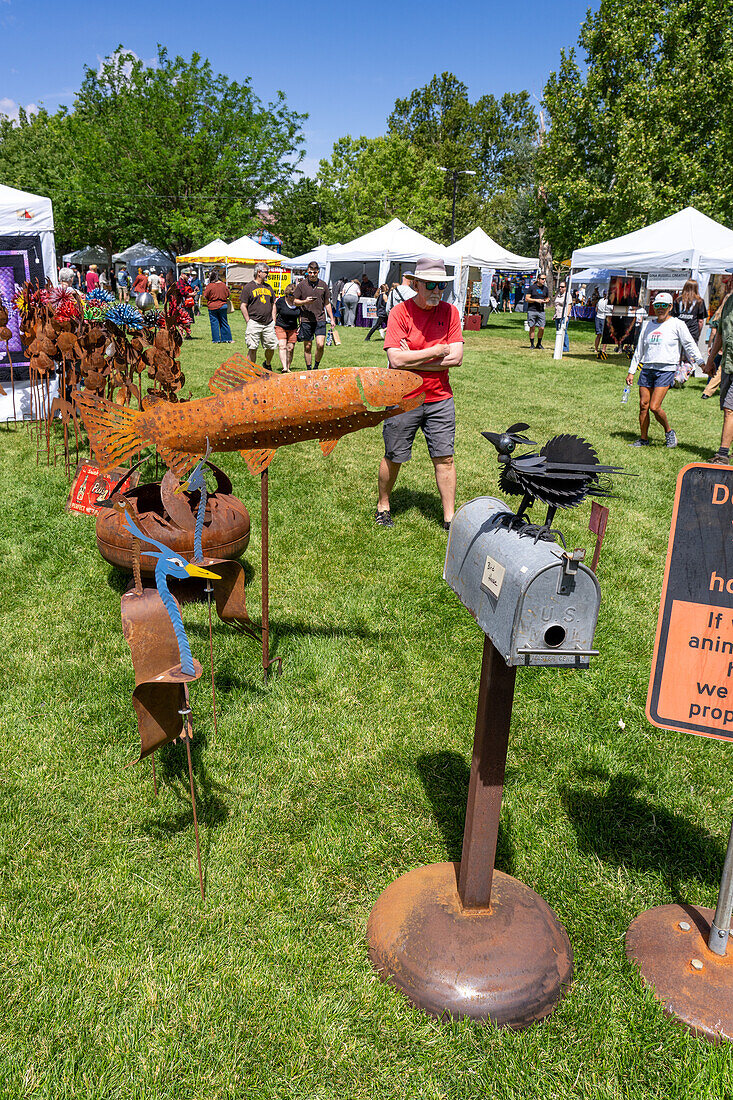 A display of whimsical metal yard art for sale at the annual Moab Arts Festival in Moab, Utah.