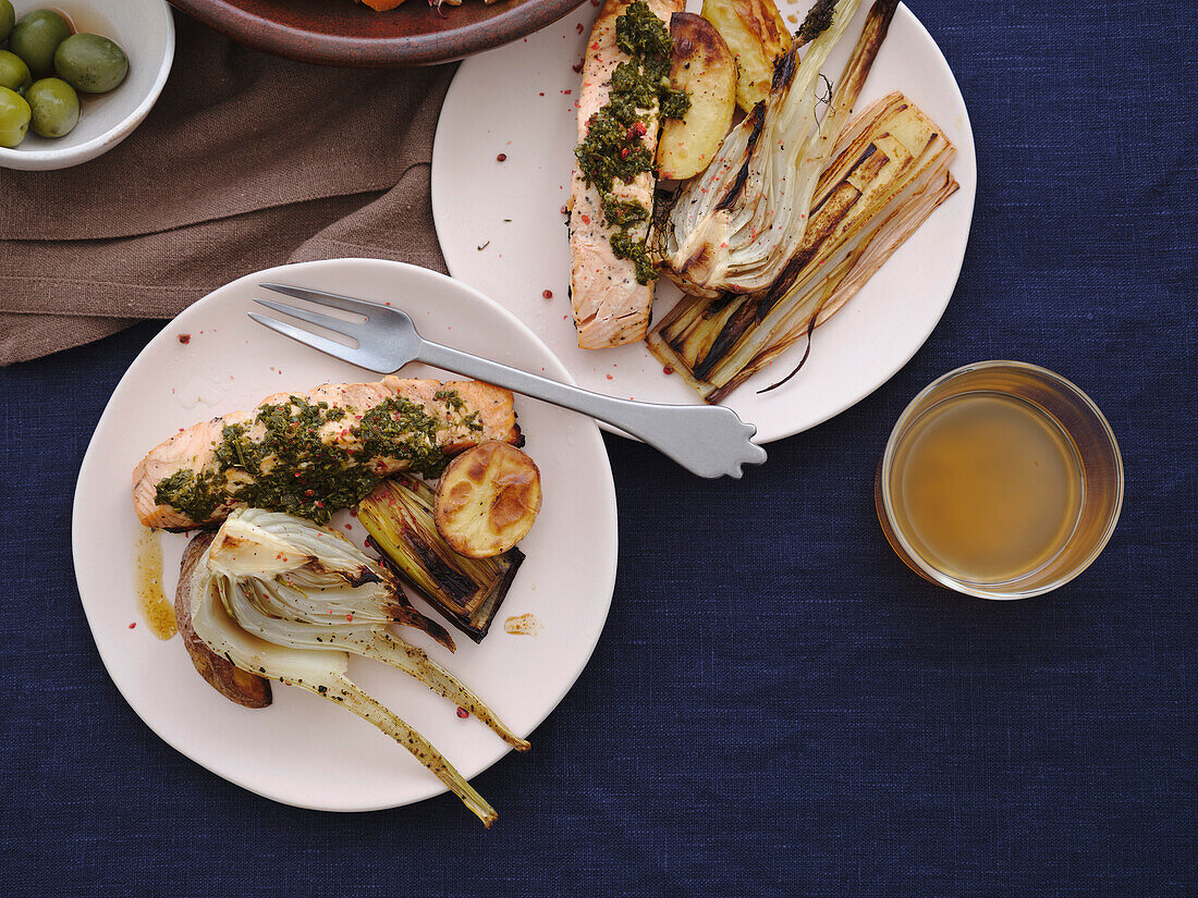 Still life view from above healthy meal with grilled salmon and leeks, and kombucha