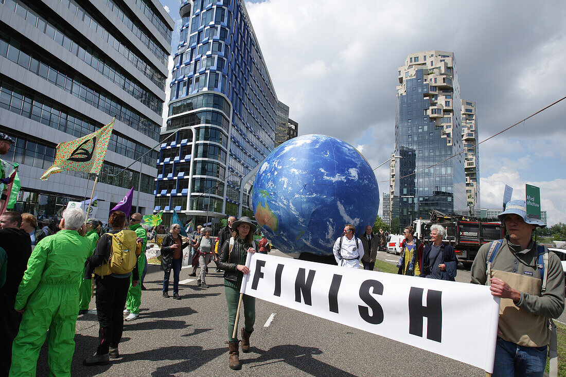 Environmental activists gather during march protest at the Zuidas financial district on May 31, 2024 in Amsterdam,Netherlands. Thousands of the environmental activists and supporters make a demonstration against the lobby of the large companies, their influence on politics, climate and ecological crisis and this consequences and demand a citizen's assembly for a just climate policy.