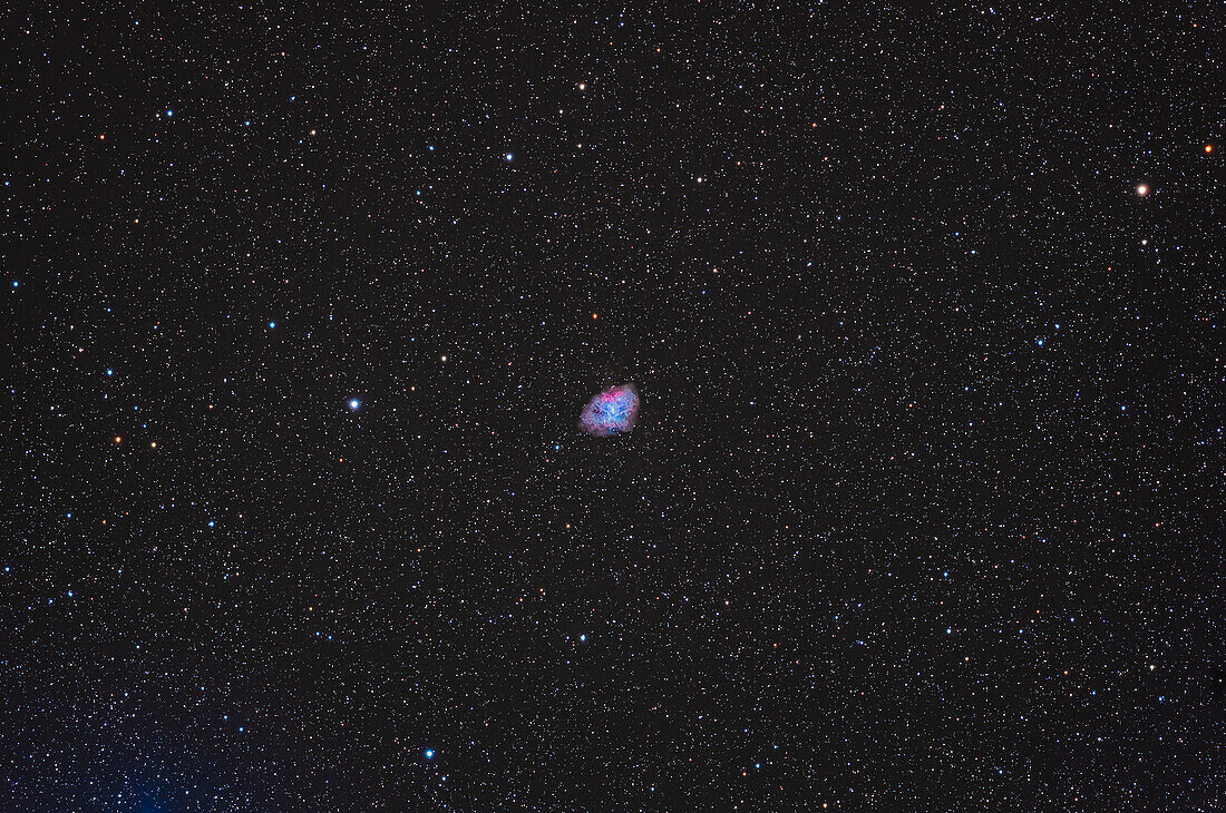 This is Messier 1, the first entry in Charles Messier's 18th century catalogue of deep-sky objects that were not to be mistaken for comets, his real quest. It is also NGC 1952, or the Crab Nebula, from the Earl of Rosse's 19th century description and naming. It is north of the lower horn of Taurus the Bull. This is a remnant cloud of debris expanding away from a supernova explosion that was witnessed in 1054 CE. All that's left of the progeniitor star now is a neutron star forming a spinning pulsar at the heart of the explosion debris. Some red H-alpha tendrils are obvious around the extremity