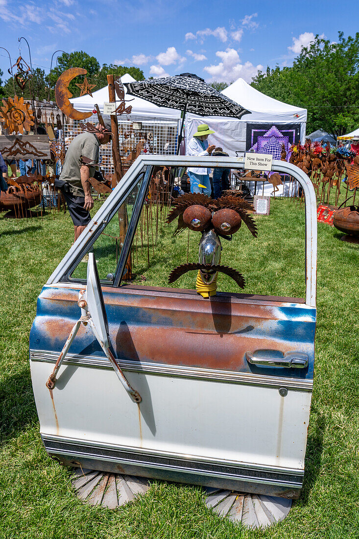 A display of whimsical metal yard art for sale at the annual Moab Arts Festival in Moab, Utah.