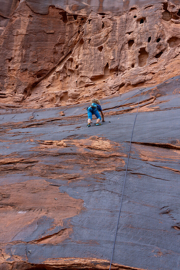 A young boy, age 6, learning to rock climb in Hunter Canyon near Moab, Utah.