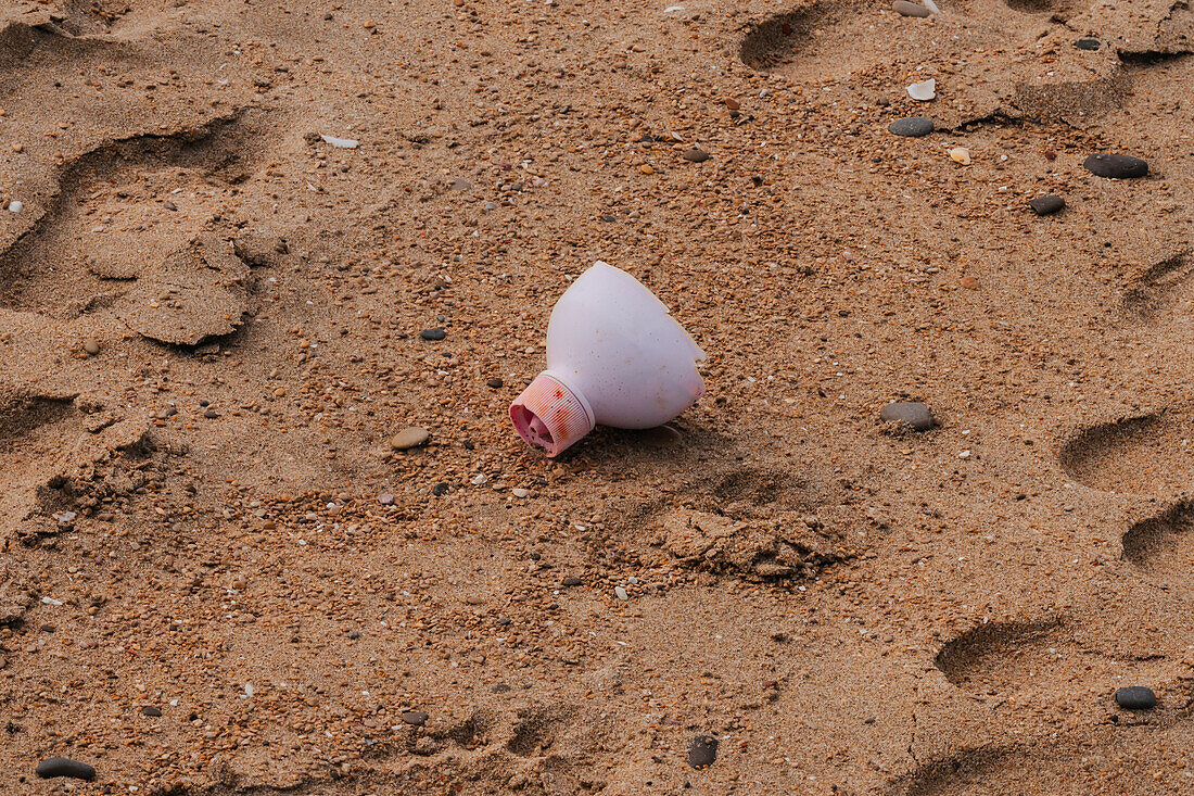 Piece of plastic bottle on the beach