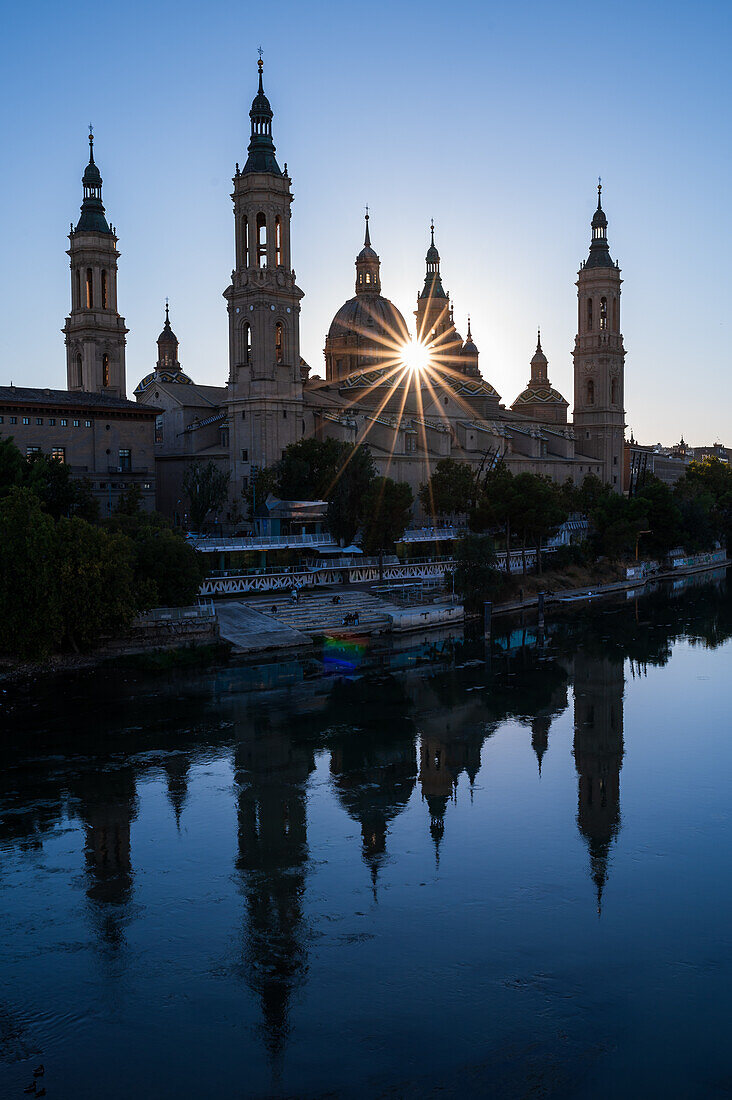 Cathedral-Basilica of Our Lady of the Pillar and the Ebro River bank at sunset, Zaragoza, Spain