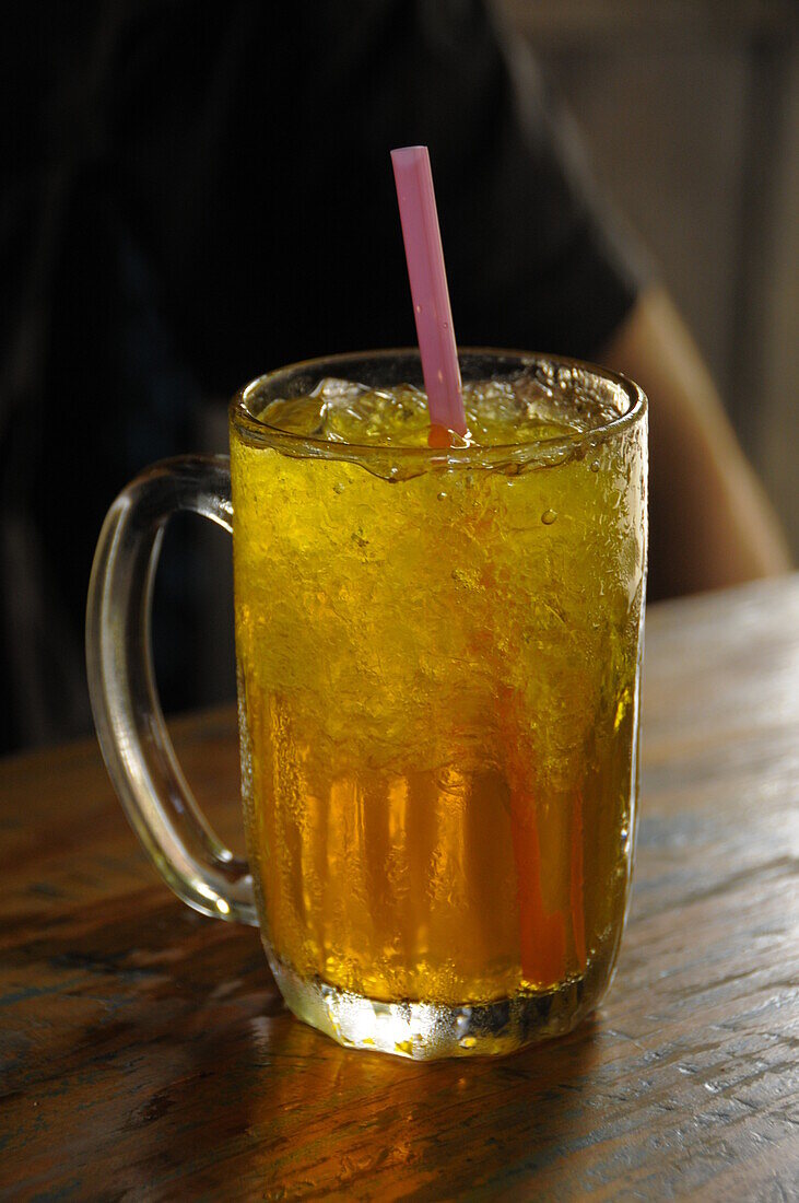 A glass of chrysanthemum iced tea in a street tea shop in Bangkok, Thailand, Southeast Asia, Asia