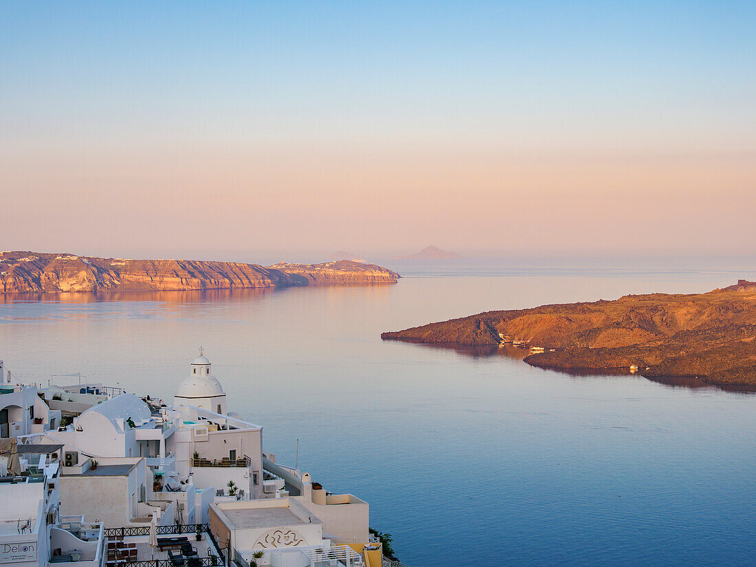 Church of Agios Minas and the Caldera at sunrise, Fira, Santorini (Thira) Island, Cyclades, Greek Islands, Greece, Europe