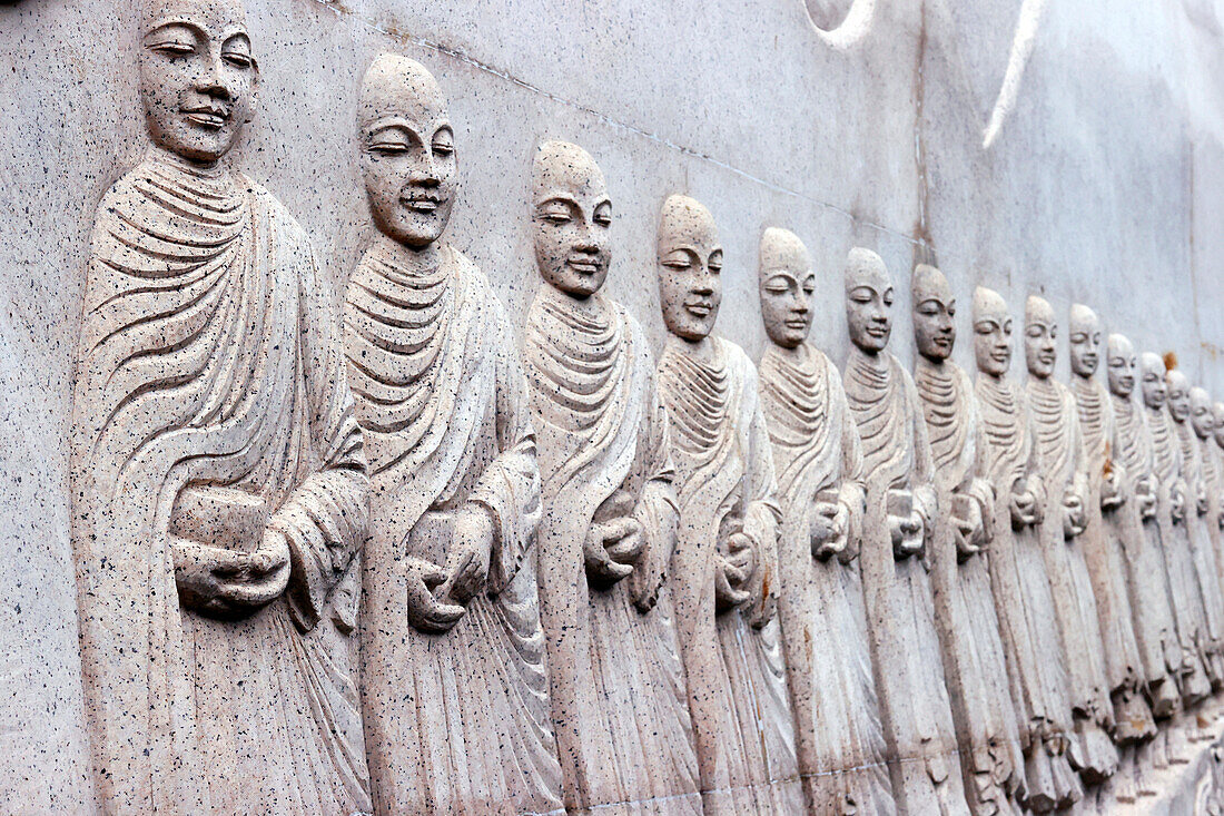 Carved relief showing Buddhist monks (Sangha) with alms bowls, Phap Vien Minh Dang Quang pagoda, Ho Chi Minh City, Vietnam, Indochina, Southeast Asia, Asia