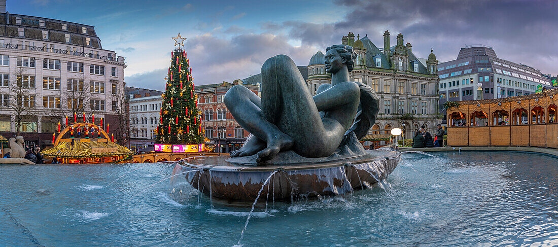 View of Christmas Market stalls and The River fountain (The Floozie in the Jacuzzi), Victoria Square, Birmingham, West Midlands, England, United Kingdom, Europe