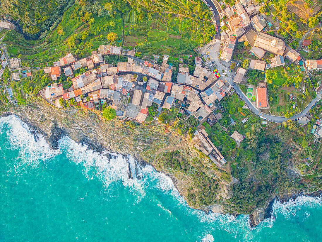 Aerial view taken by drone of the famous village of Corniglia, Cinque Terre National Park, UNESCO World Heritage Site, La Spezia, Liguria, Italy, Europe