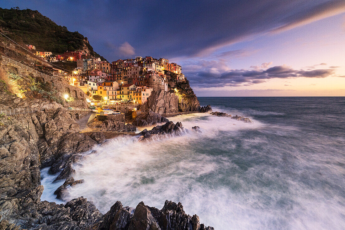 Magical light envelops the famous village of Manarola during an autumn sunset, Manarola, Cinque Terre National Park, UNESCO World Heritage Site, La Spezia, Liguria, Italy, Europe