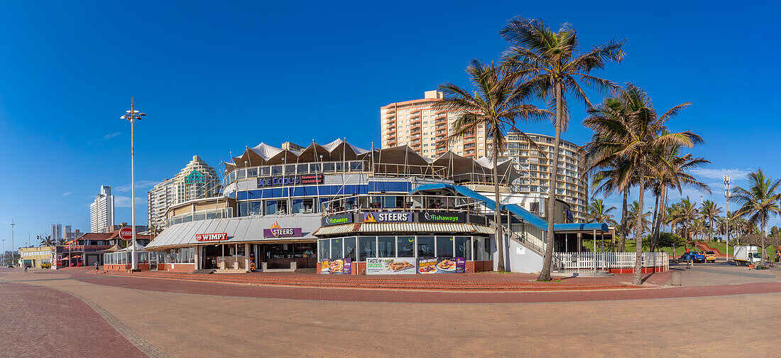 View of shops, restaurants and bars on promenade, Durban, KwaZulu-Natal Province, South Africa, Africa