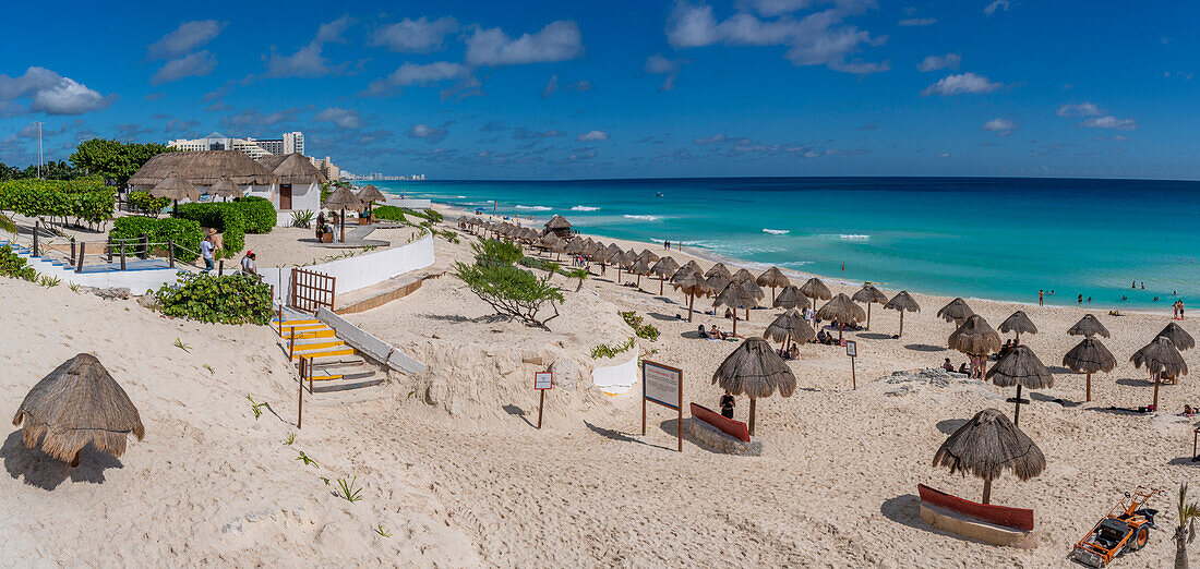 View of long white sandy beach at Playa Delfines, Hotel Zone, Cancun, Caribbean Coast, Yucatan Peninsula, Mexico, North America