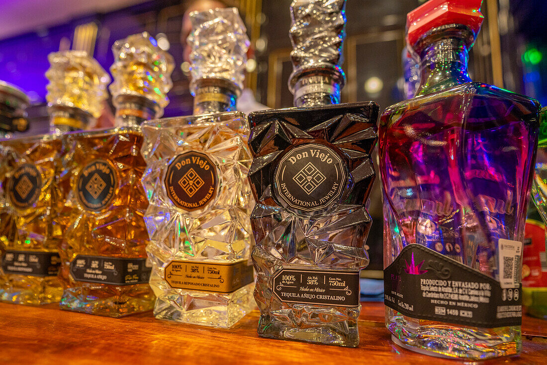 View of colourful Tequila bottles, Hotel Zone, Cancun, Caribbean Coast, Yucatan Peninsula, Mexico, North America