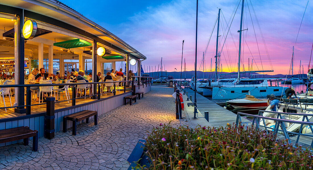 View of golden sunset, boats and restaurants at Knysna Waterfront, Knysna, Western Cape Province, South Africa, Africa