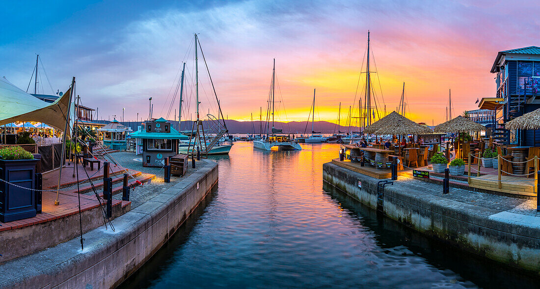 View of golden sunset, boats and restaurants at Knysna Waterfront, Knysna, Western Cape Province, South Africa, Africa