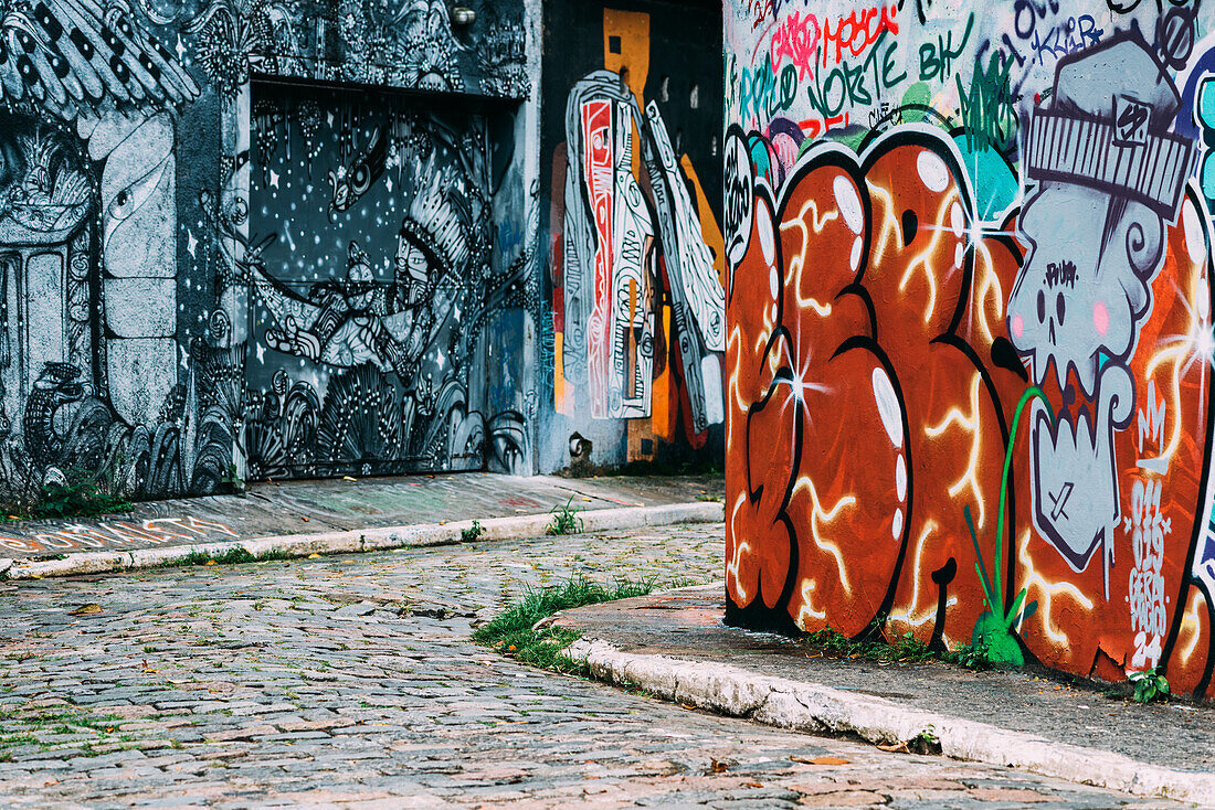 Beco do Batman, the nickname for the area around the Vila Madalena neighborhood with its dense concentation of graffiti lining the streets, popular with tourists, Sao Paulo, Brazil, South America