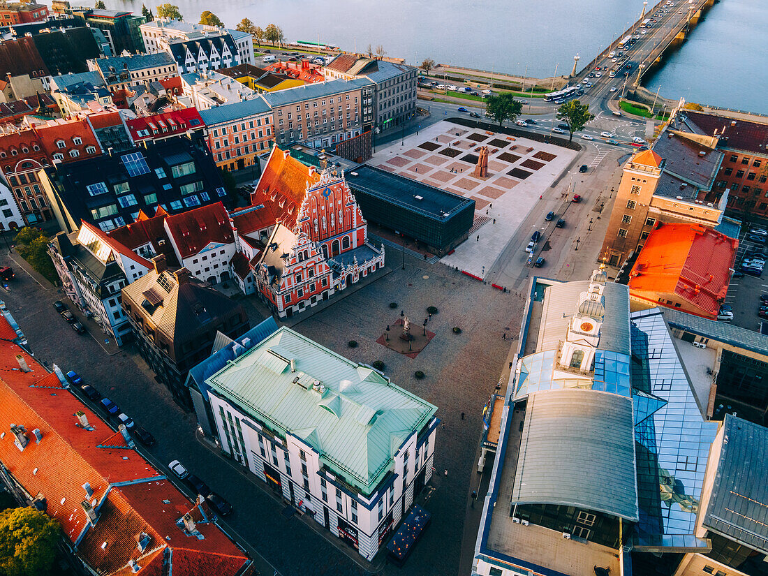 Aerial drone sunrise view of Rathausplatz and House of the Black Heads, Riga Old Town (Vecriga), UNESCO World Heritage Site, Riga, Latvia, Europe