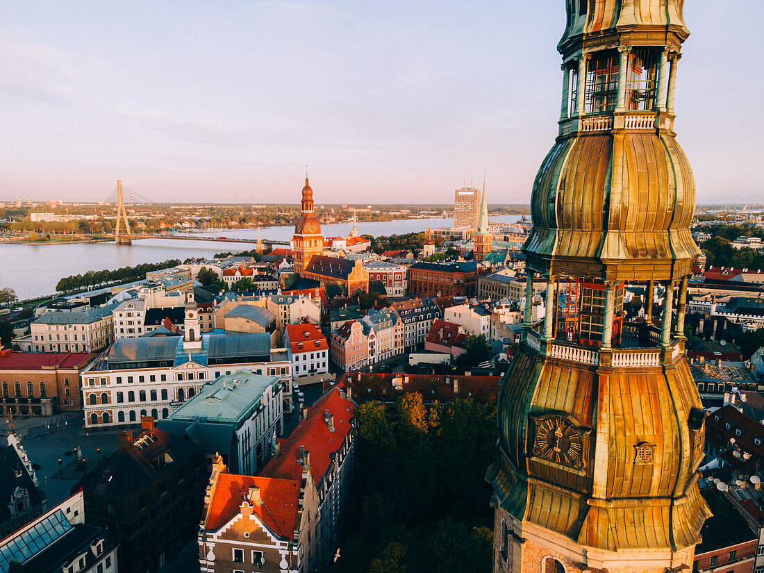 Aerial drone sunrise view of St. Peter's Church in Riga Old Town (Vecriga), UNESCO World Heritage Site, Riga, Latvia, Europe