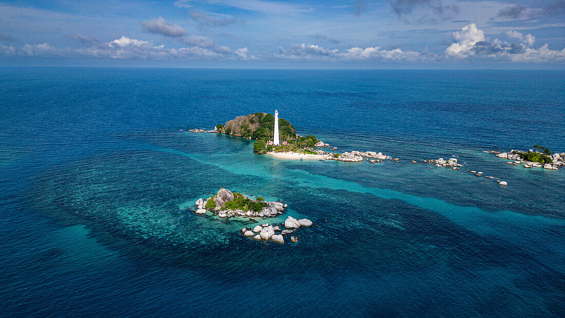 Aerial of Old Indie Lighthouse, Lengkuas Island, Belitung island off the coast of Sumatra, Indonesia, Southeast Asia, Asia