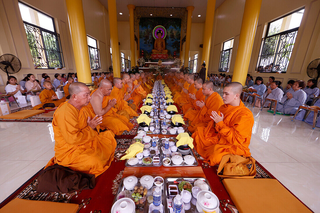 Vegetarian meal, Monks at Buddhist ceremony in the main hall, Phuoc Hue Buddhist pagoda, Vietnam, Indochina, Southeast Asia, Asia