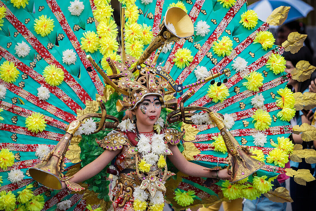 Girl in elaborate peacock style costume at the annual Tomohon International Flower Festival parade, Tomohon, North Sulawesi, Sulawesi, Indonesia, Southeast Asia, Asia